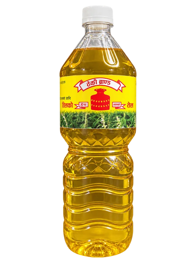 Theki sesame oil in its white-capped PET bottle; photo-based packshot